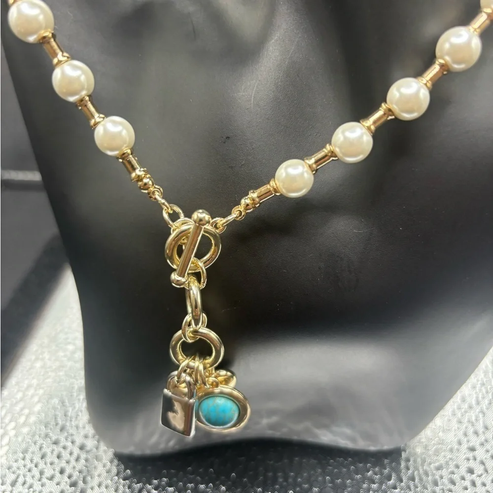 Elegant Pearl and Gold Necklace with Turquoise charm, a heart and a lock.